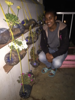 Kalkidan pulled ideas from the internet on recycling old bottles, to turn the girls' hostel balcony into a beautiful flower display